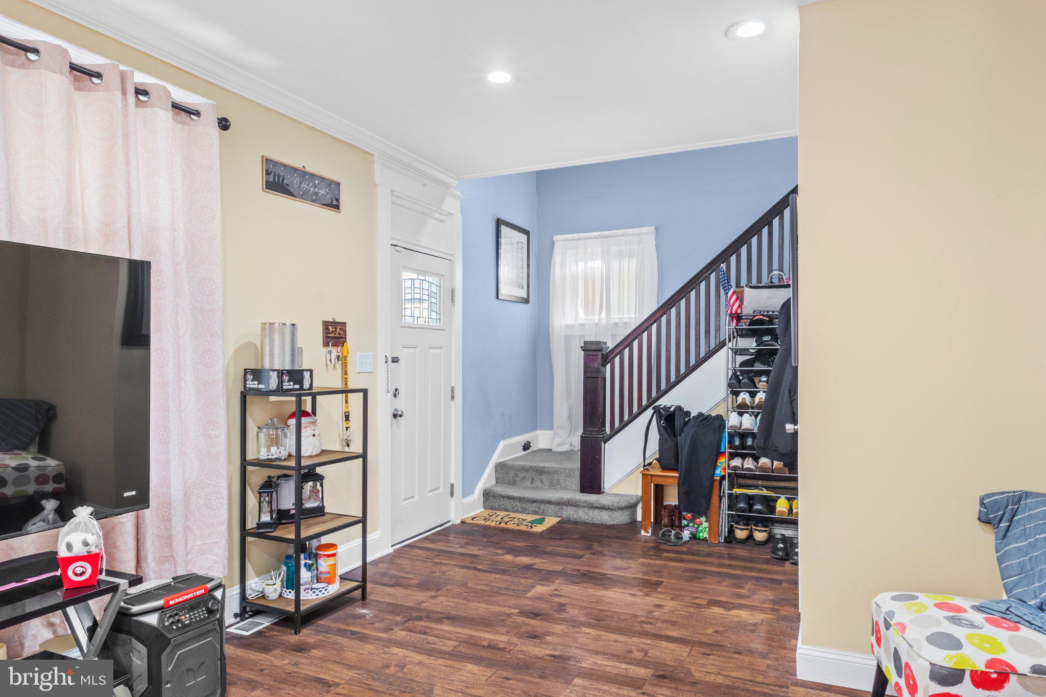 130 West Edgevale Road Baltimore, MD 21225 - Photo 9 of 37 a view of entryway with stairs and furniture