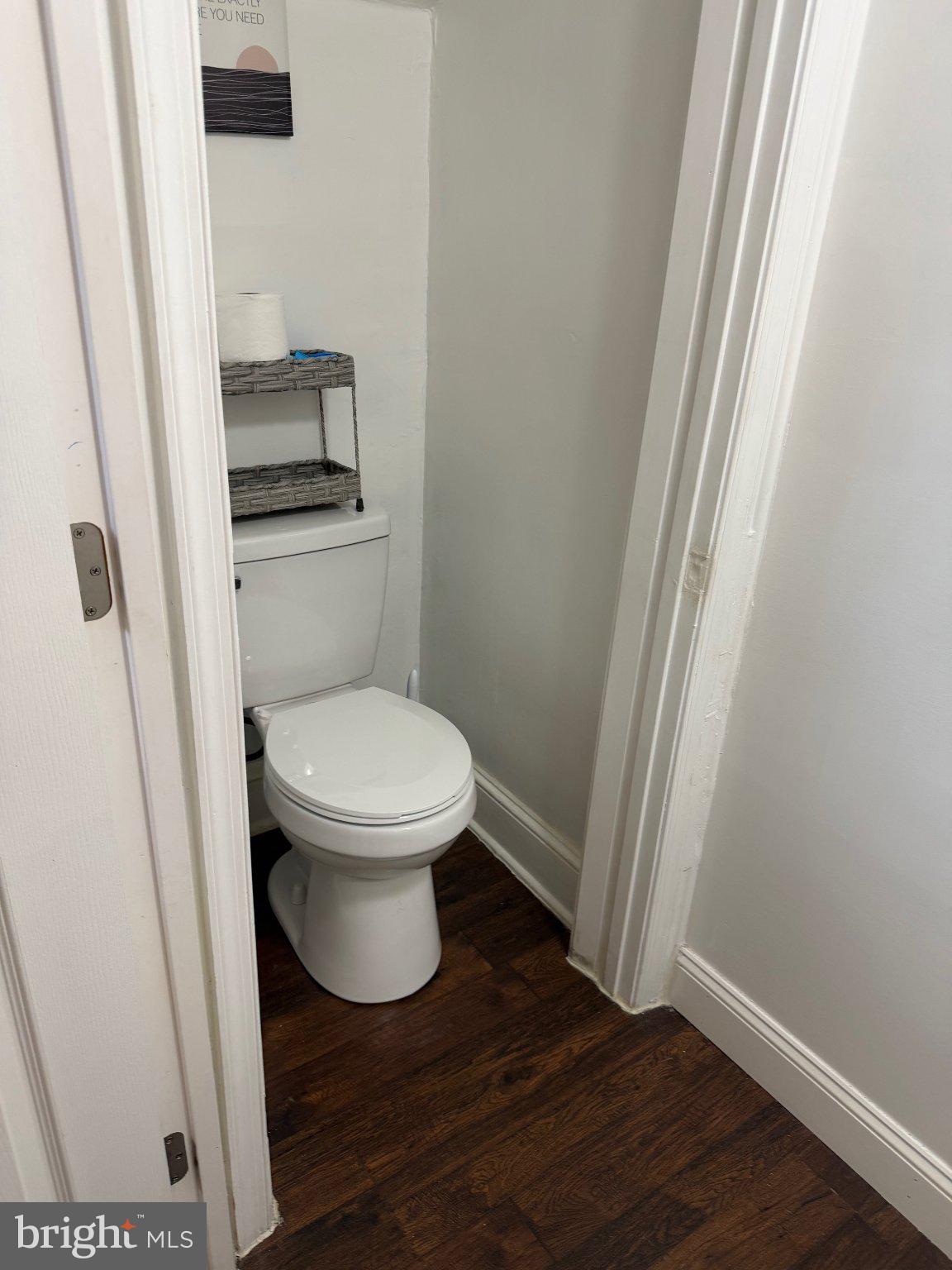 130 West Edgevale Road Baltimore, MD 21225 - Photo 10 of 37 a white toilet sitting next to a small sink
