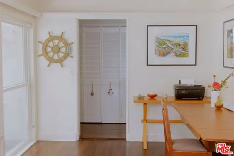 a bedroom with furniture and a potted plant