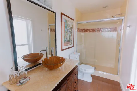 a flower garden in front of a house