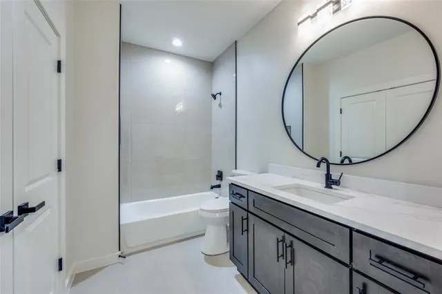 a bathroom with a sink a vanity and a mirror