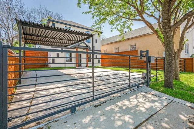 a view of backyard with deck and a garden