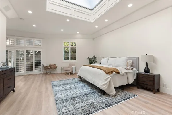 a bedroom with double bed and a couch