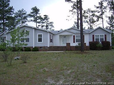 320 Ridge View Drive Cameron, NC 28326 - Photo 1 of 27 a front view of a house with a yard