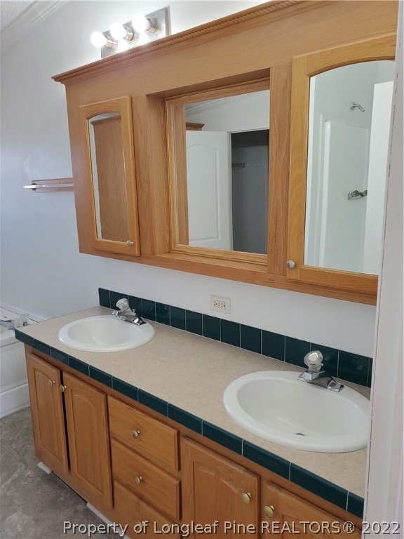 320 Ridge View Drive Cameron, NC 28326 - Photo 14 of 27 a bathroom with a sink and a mirror