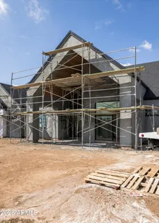 a view of a house with a big yard