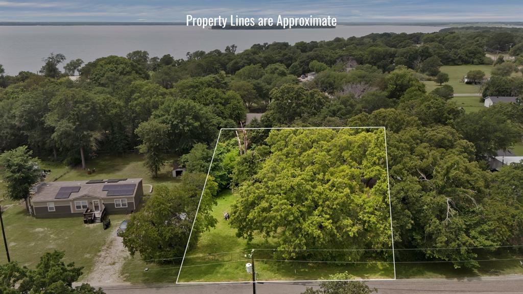 Tbd Cherry Blossom Kemp, TX 75143 - Photo 5 of 7 a view of a street with a building in the background