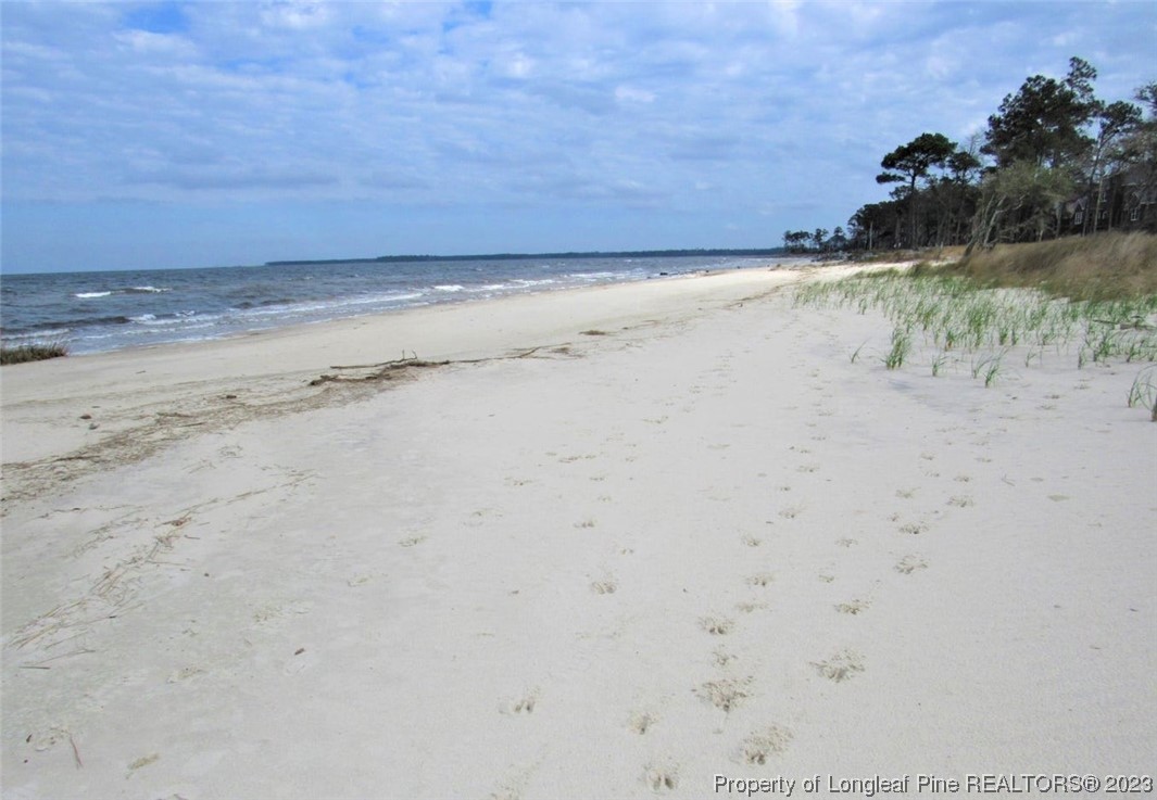 558 Sandy Point Drive Beaufort, NC 28516 - Photo 1 of 2 a view of beach and ocean