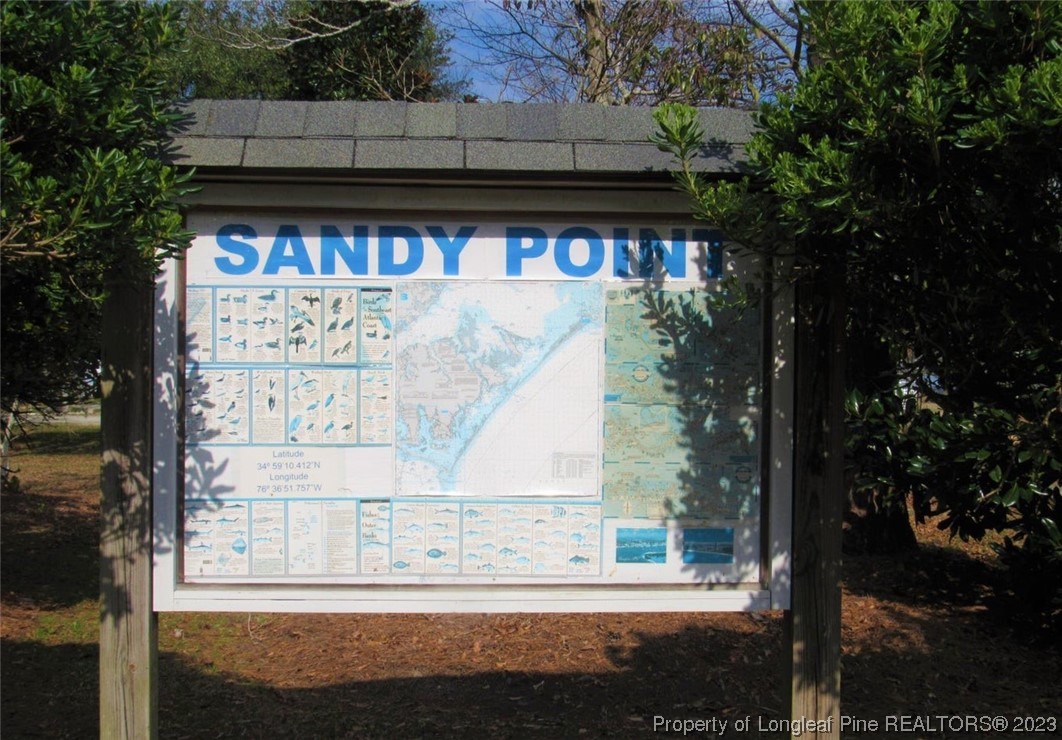 558 Sandy Point Drive Beaufort, NC 28516 - Photo 2 of 2 a view of a sign board