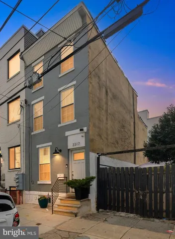 a front view of a building with pathway