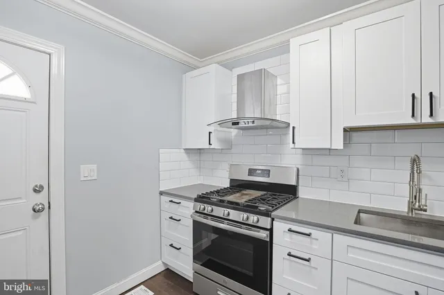 a view of a kitchen with electric appliances