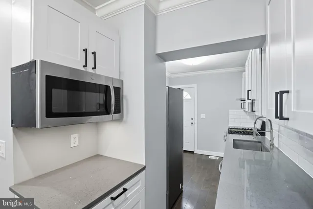 a view of a kitchen from the hallway