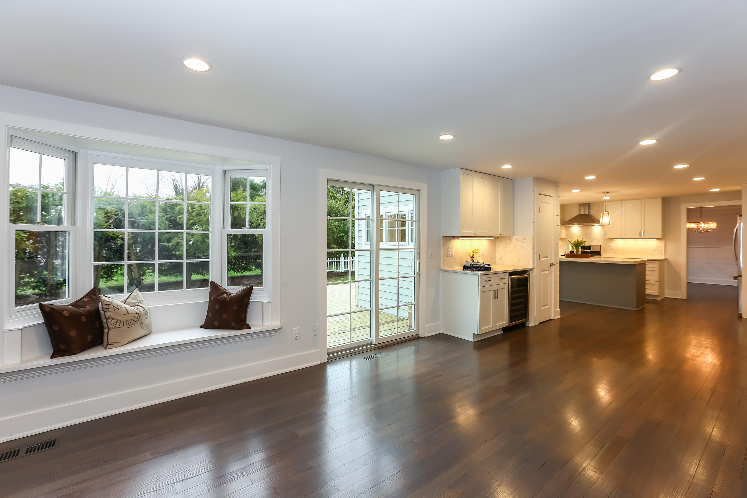 68 Relihan Road Darien, CT 06820 - Photo 13 of 27 a living room with furniture floor to ceiling window and wooden floor