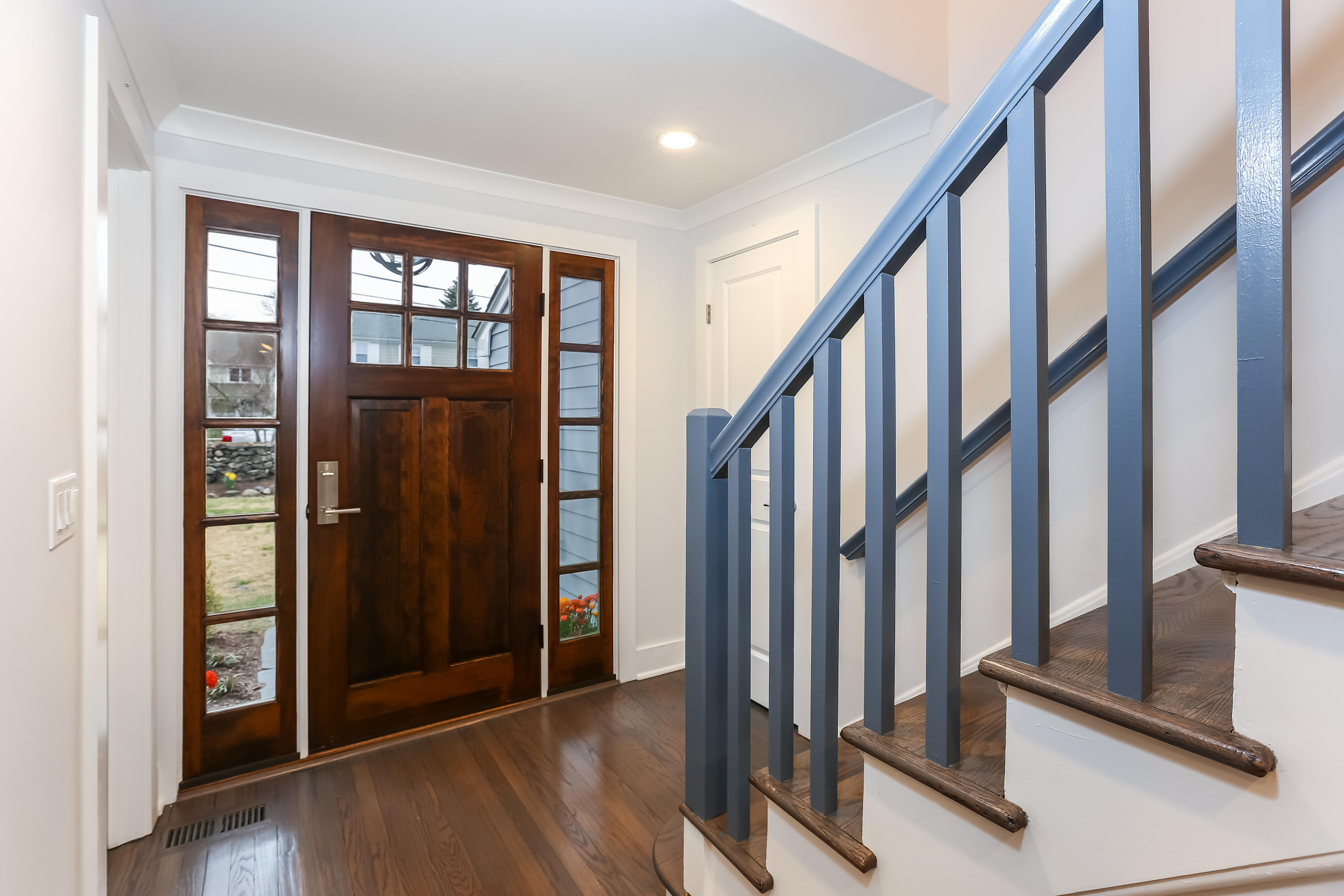 68 Relihan Road Darien, CT 06820 - Photo 3 of 27 a view of an entryway with wooden floor and door