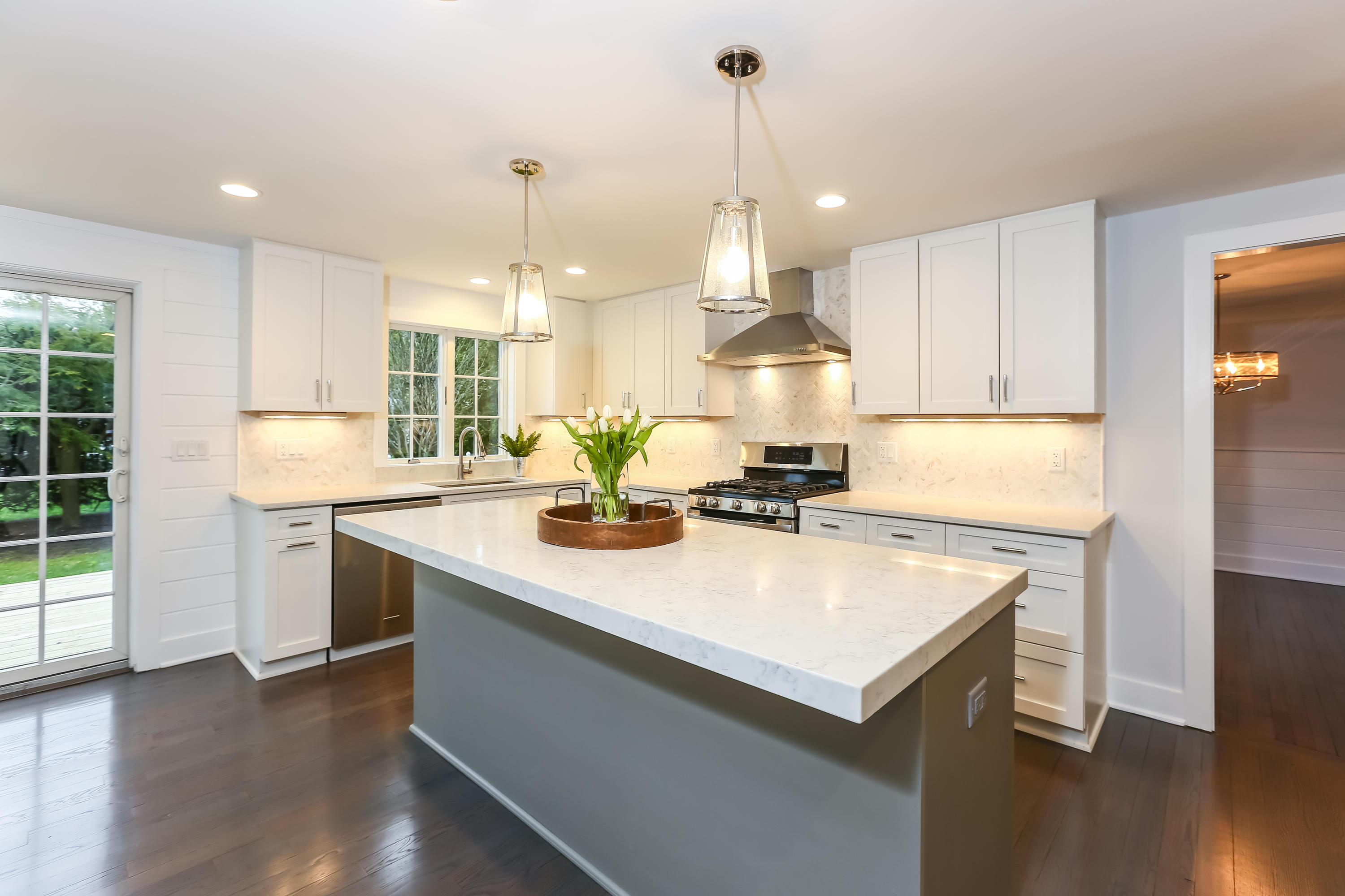 68 Relihan Road Darien, CT 06820 - Photo 8 of 27 a kitchen with kitchen island a stove a sink a center island and wooden floor