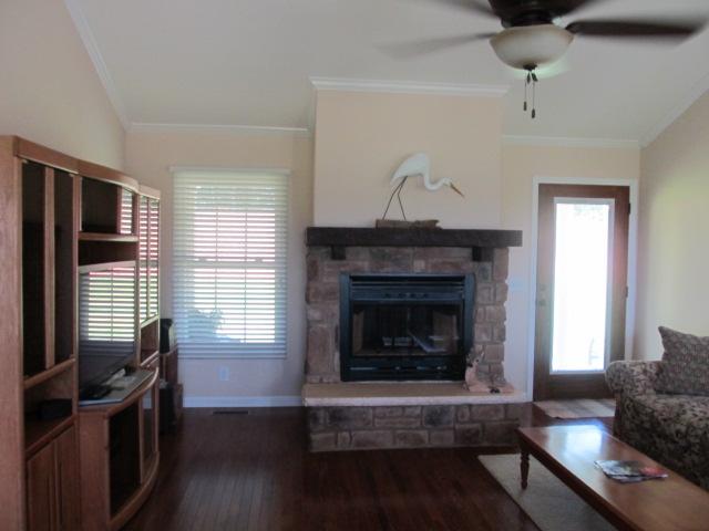 545 Tri Cities Farm Road Winchester, TN 37398 - Photo 13 of 14 Great room boosts of cathedral ceilings,rock fireplace and hardwood floors.