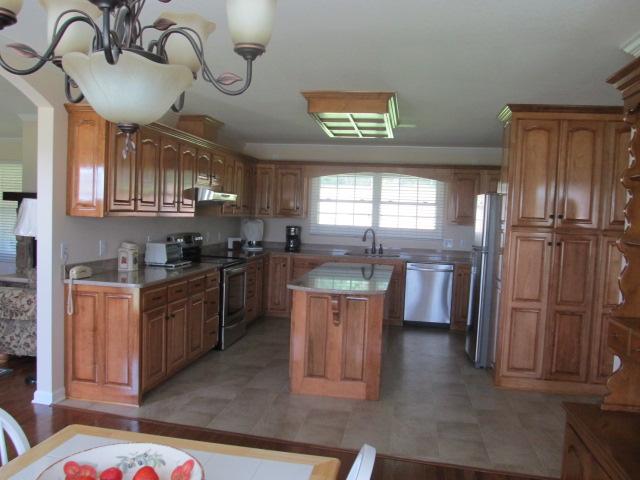 545 Tri Cities Farm Road Winchester, TN 37398 - Photo 3 of 14 Kitchen has custom built cabinets, quartz counters, large built-in area for more storgage.