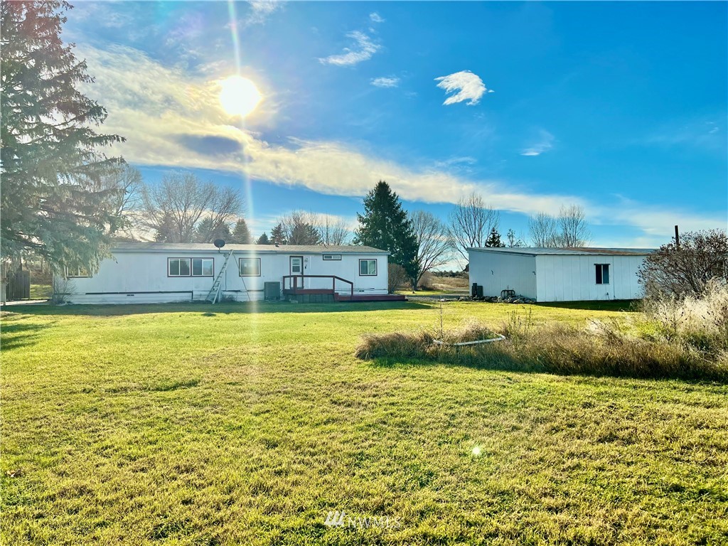 53 Woods Road Omak, WA 98841 - Photo 39 of 40 a view of swimming pool with outdoor seating and plants