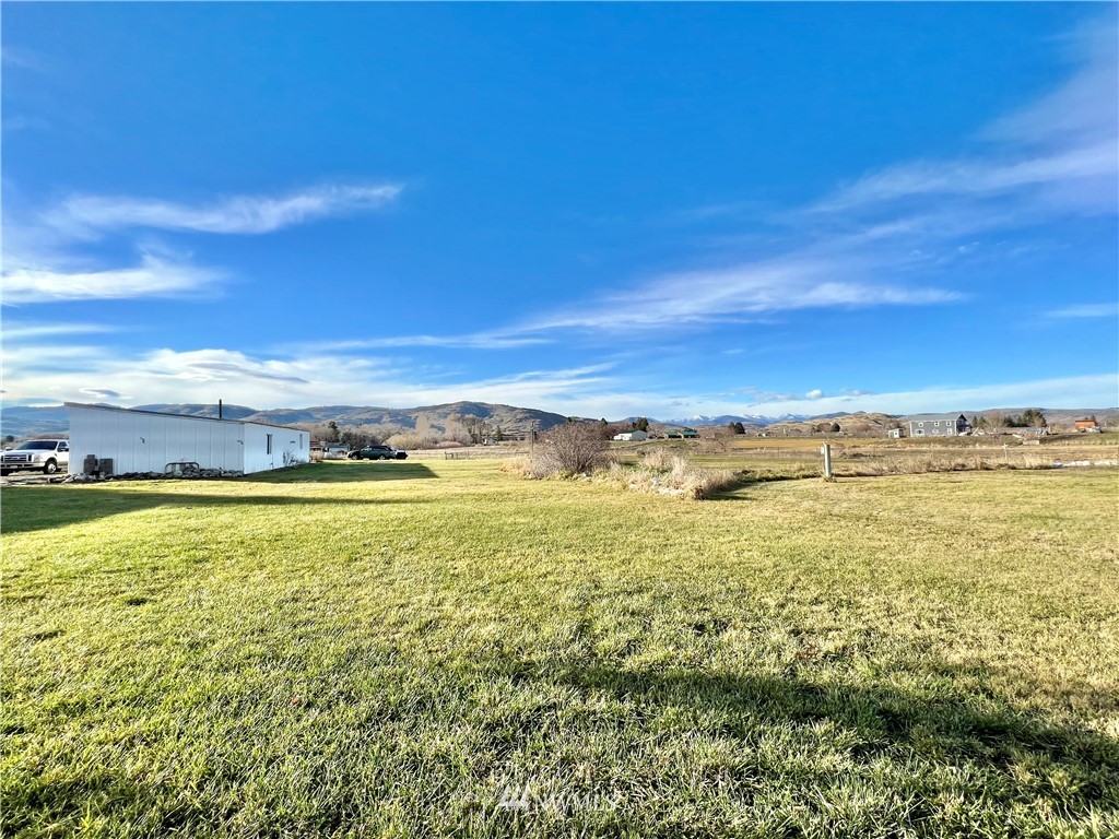 53 Woods Road Omak, WA 98841 - Photo 5 of 40 a view of an ocean from a beach