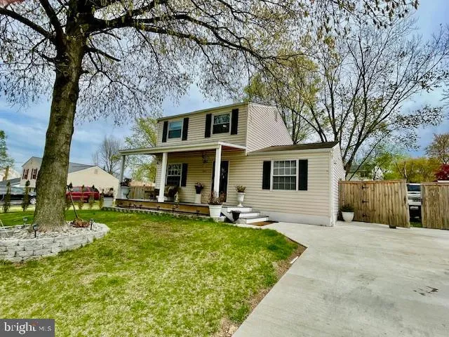 a front view of house with yard and seating area