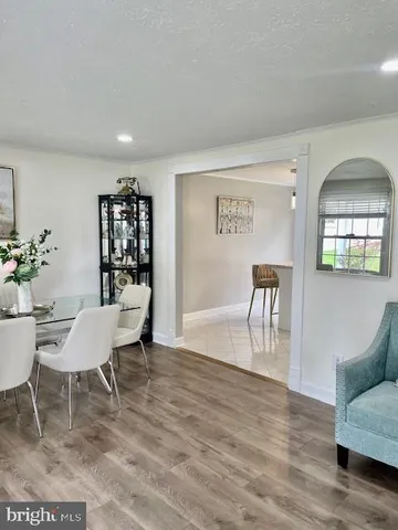 a kitchen with white cabinets stainless steel appliances and sink