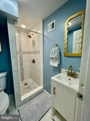 a bathroom with a toilet and shower