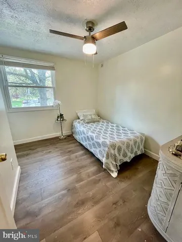 a view of a livingroom with an empty space and a window