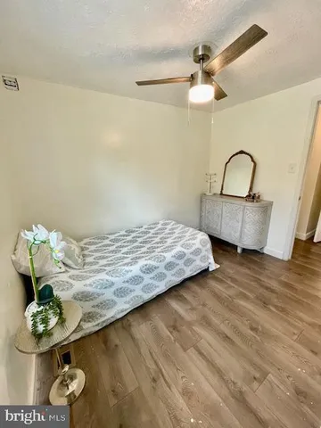 a view of a yard with wooden fence