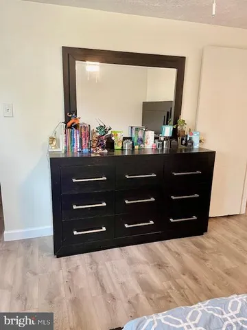 a view of yard with swimming pool and green space