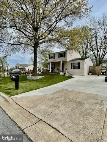 a view of backyard with sitting area