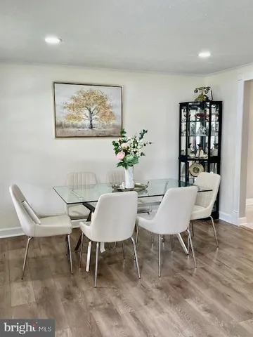a kitchen with kitchen island a sink appliances and cabinets