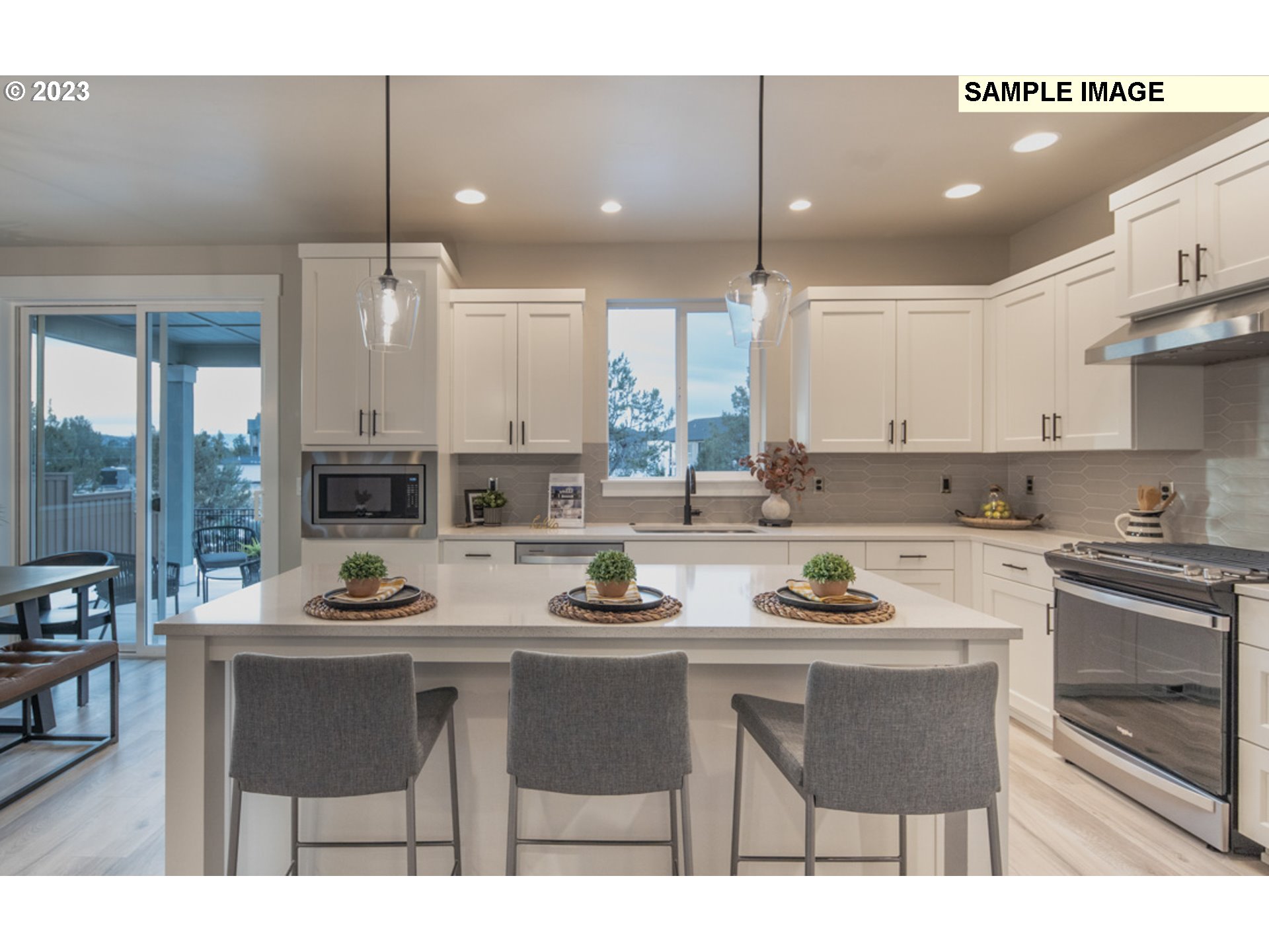 3705 South 44th Avenue Ridgefield, WA 98642 - Photo 2 of 13 a kitchen with a table chairs stove and cabinets