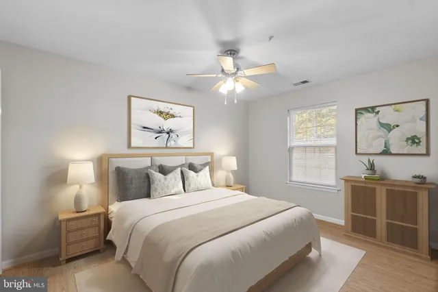 a bedroom with a large bed and a window