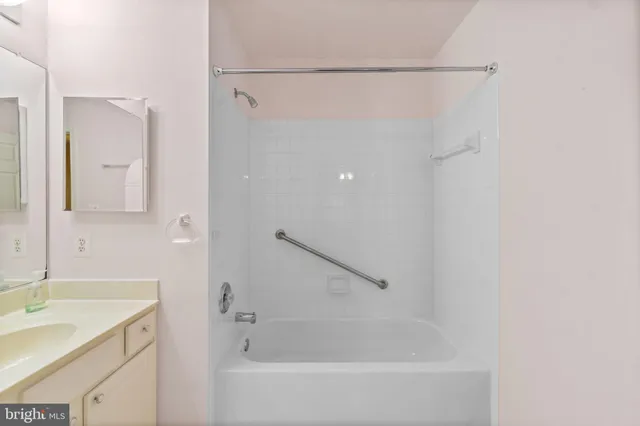 a bathroom with a bathtub and a sink