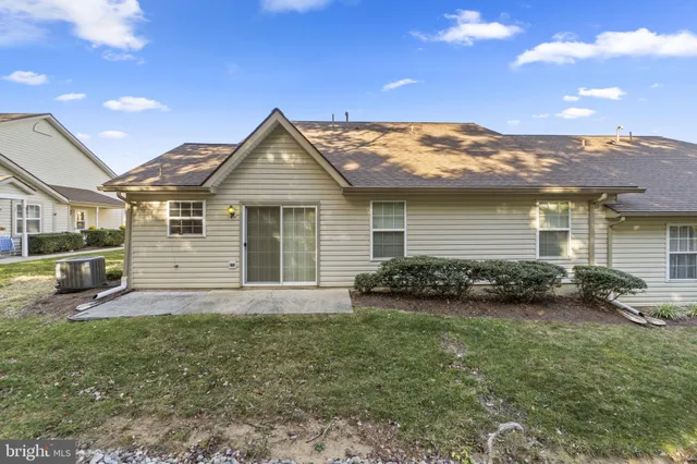a view of a backyard with a garden and plants