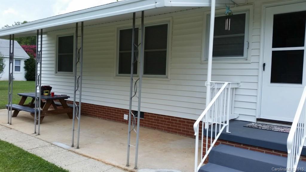 403 Shue Road China Grove, NC 28023 - Photo 2 of 15 a view of a balcony with chairs and a potted plant