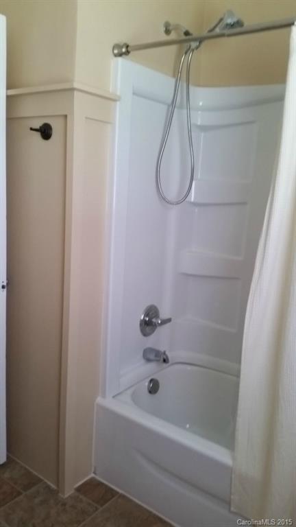 403 Shue Road China Grove, NC 28023 - Photo 14 of 15 a bathroom with a bath tub with a shower