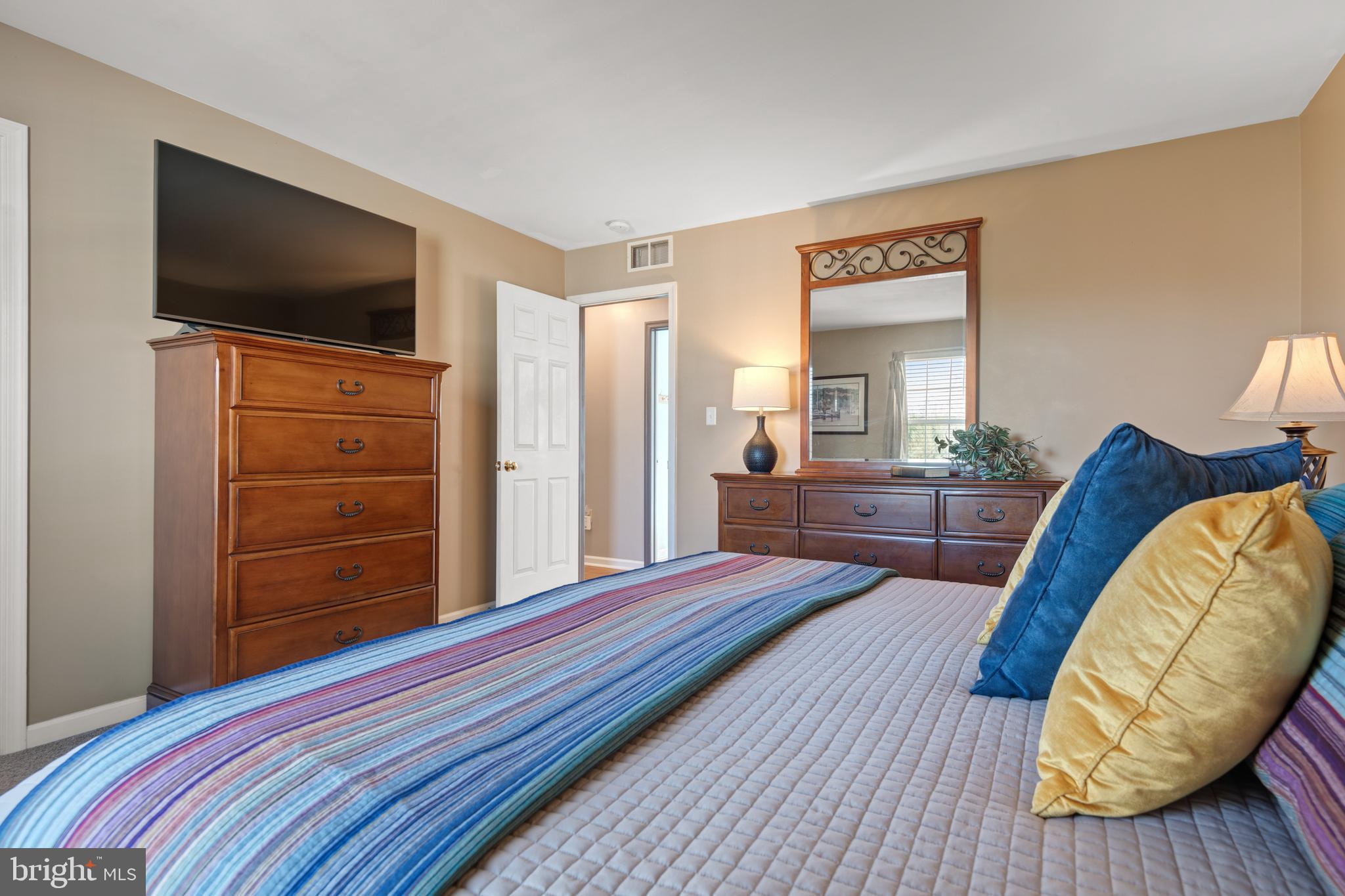 16 Pebble Creek Drive Lititz, PA 17543 - Photo 14 of 37 a bedroom with furniture and a flat screen tv