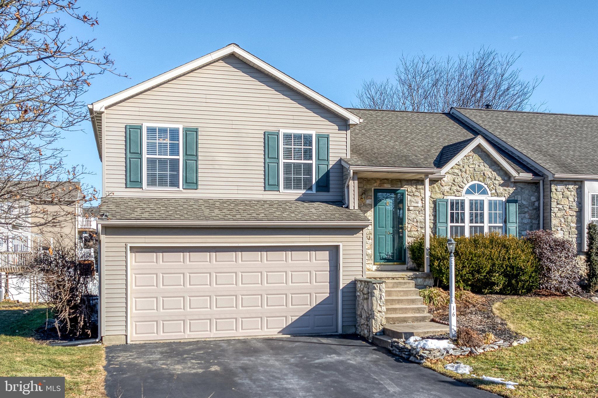 16 Pebble Creek Drive Lititz, PA 17543 - Photo 2 of 37 a view of a house with a yard and garage