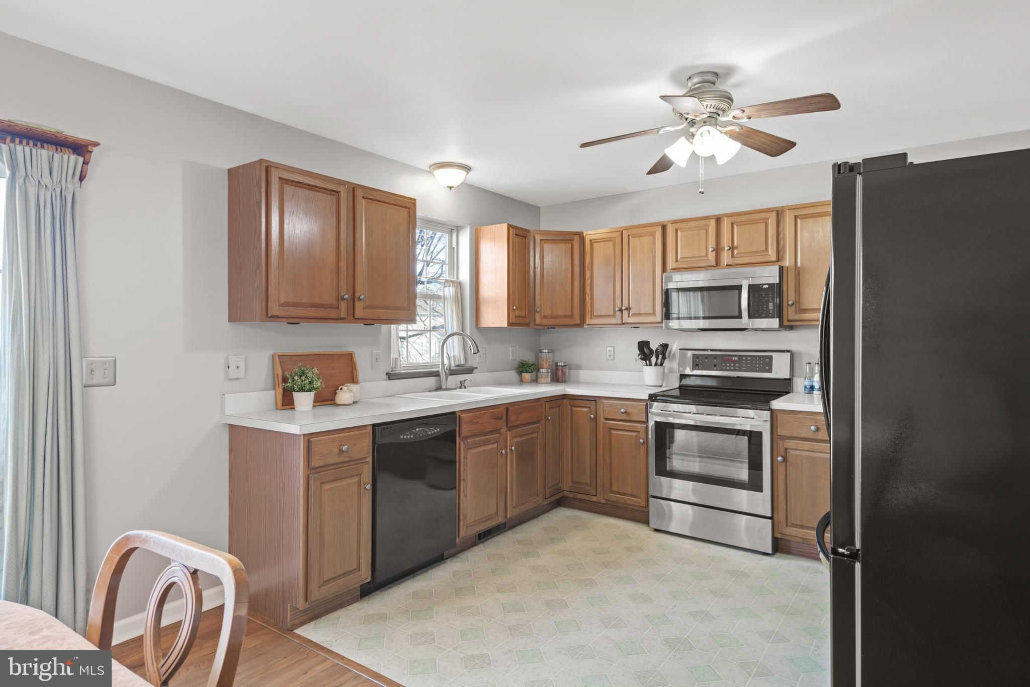 16 Pebble Creek Drive Lititz, PA 17543 - Photo 9 of 37 a kitchen with stainless steel appliances granite countertop a refrigerator sink and stove