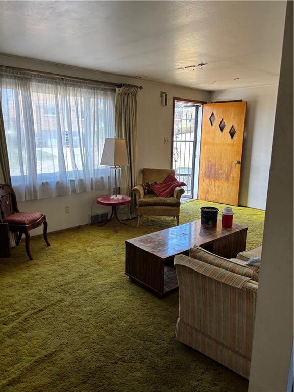 1800 McCully Road Pittsburgh, PA 15234 - Photo 7 of 12 a living room with furniture and a large window
