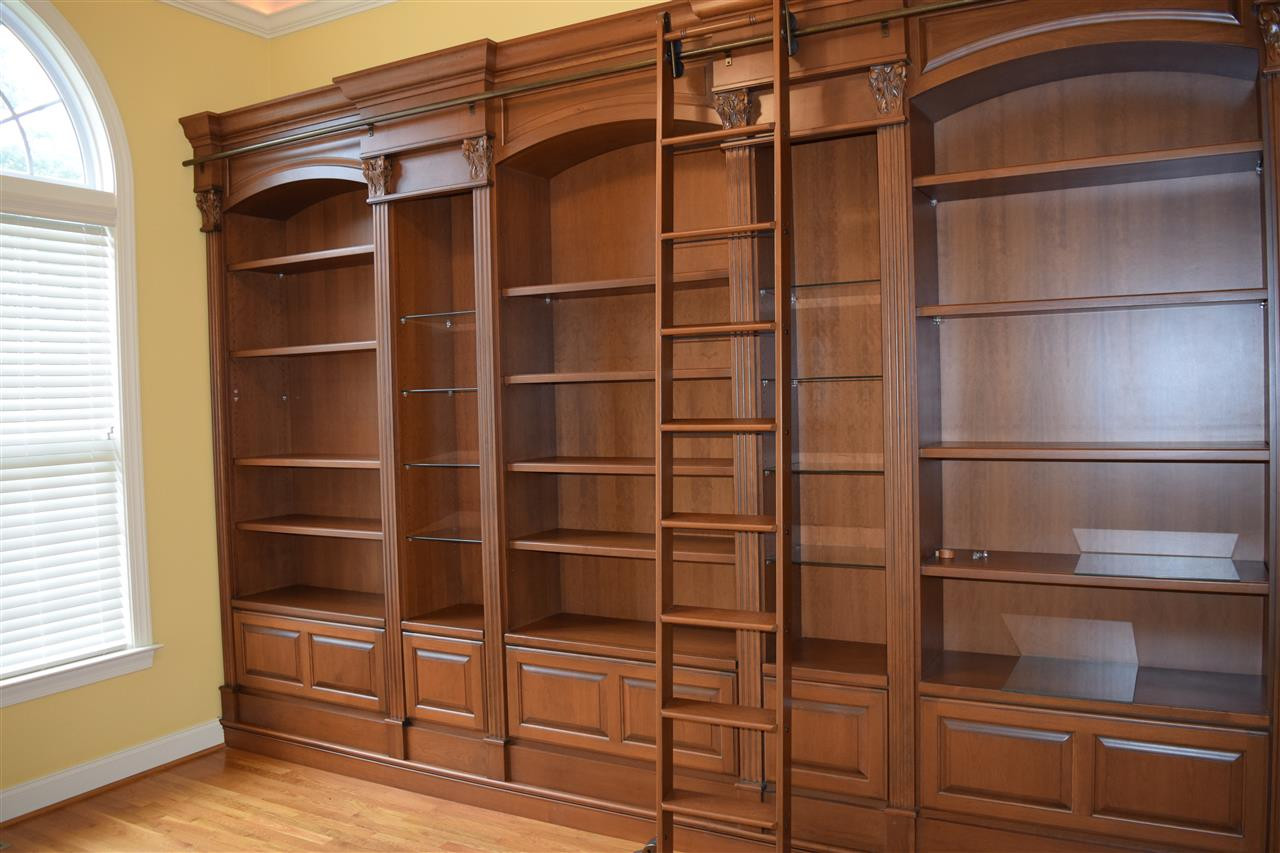 9307 Tabriz Point Raleigh, NC 27614 - Photo 1 of 24 Wall shelves with file cabinet storage and ladder. Office or Library