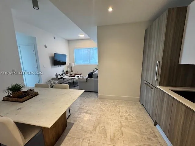 a kitchen with a sink appliances and cabinets
