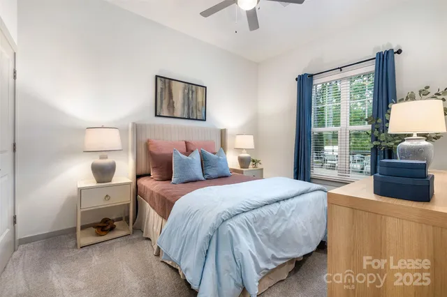 a bedroom with a bed and a couch