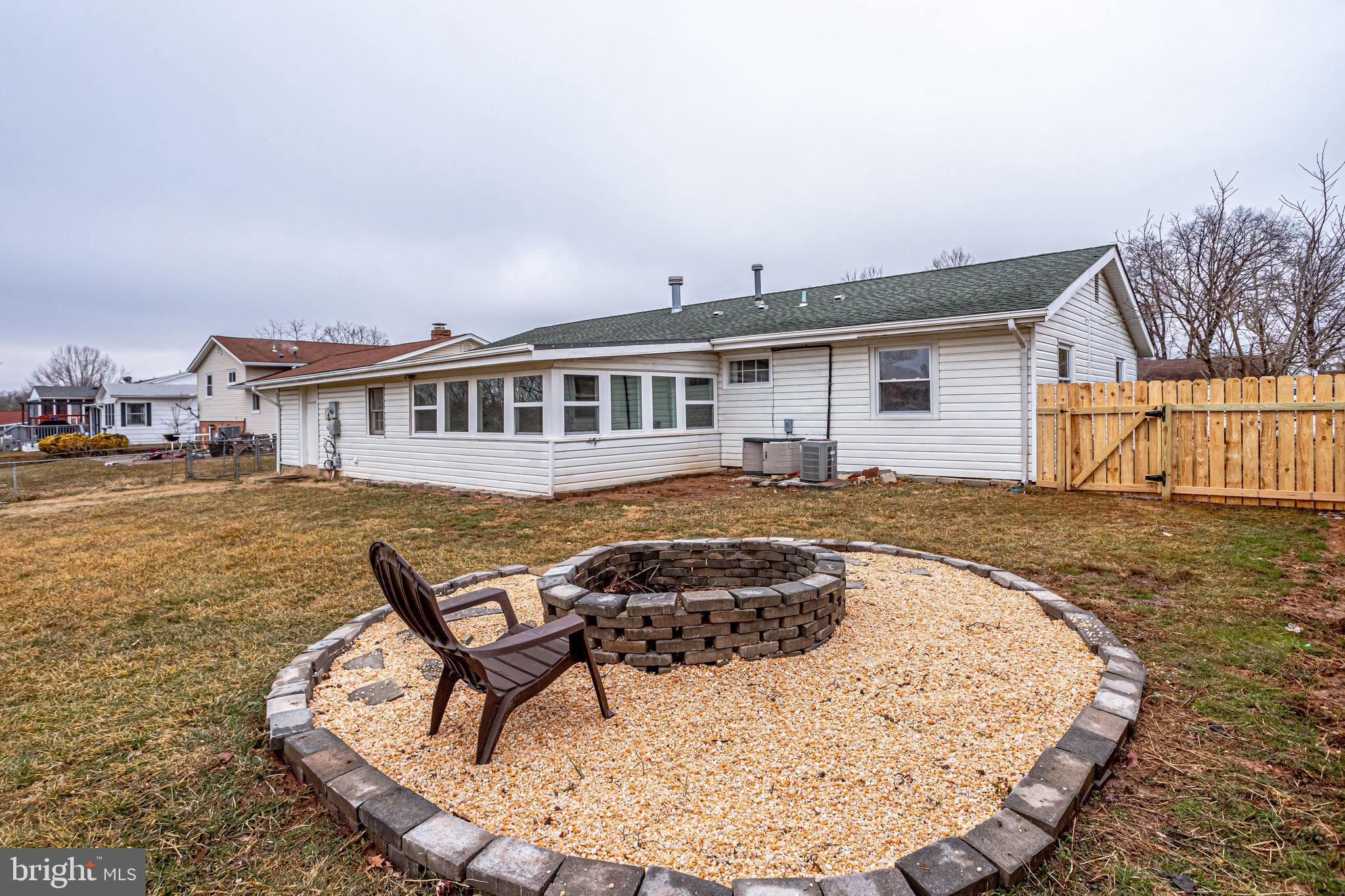 221 West Ash Road Sterling, VA 20164 - Photo 25 of 28 Large, flat, fenced backyard with fire pit
