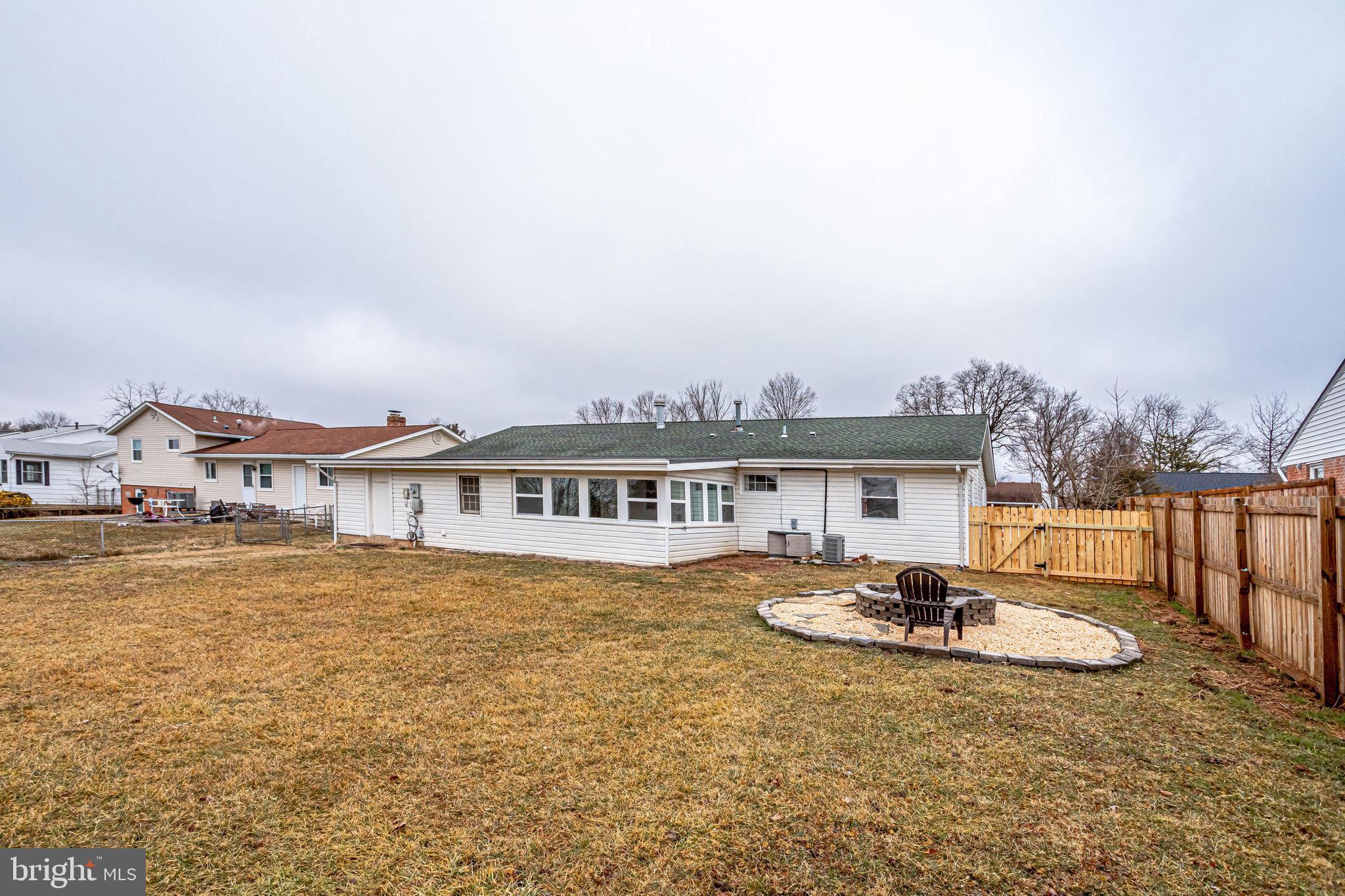 221 West Ash Road Sterling, VA 20164 - Photo 26 of 28 Large, flat, fenced backyard with fire pit
