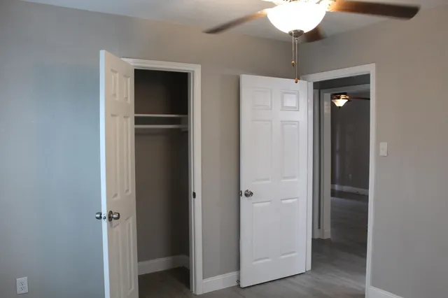 a view of an empty room with a bathroom