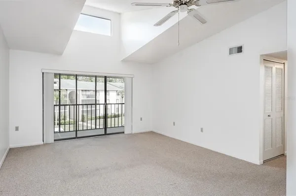 a view of an empty room with a window