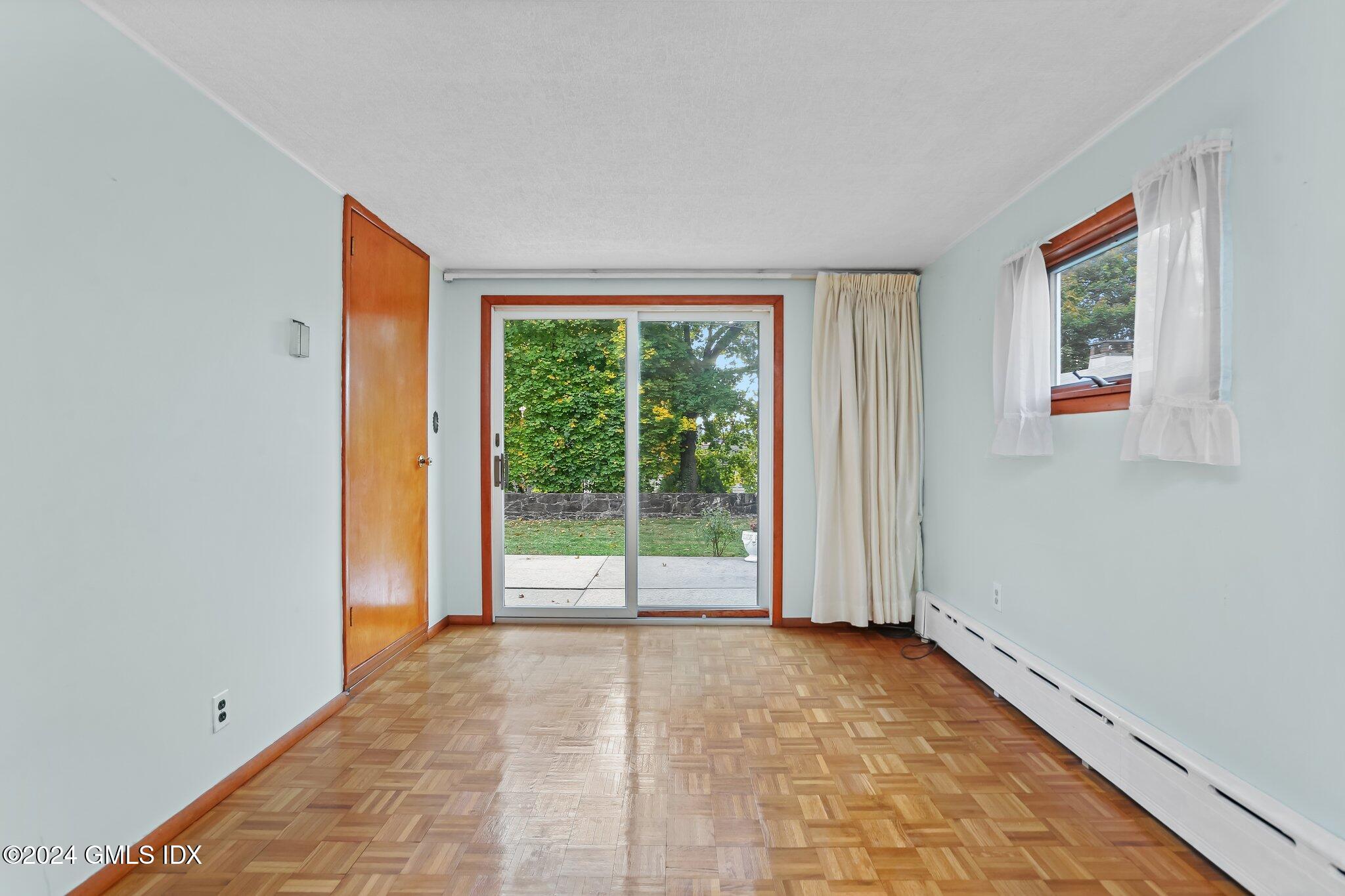 20 Norias Road Greenwich, CT 06830 - Photo 14 of 40 a view of an empty room with wooden floor and a window