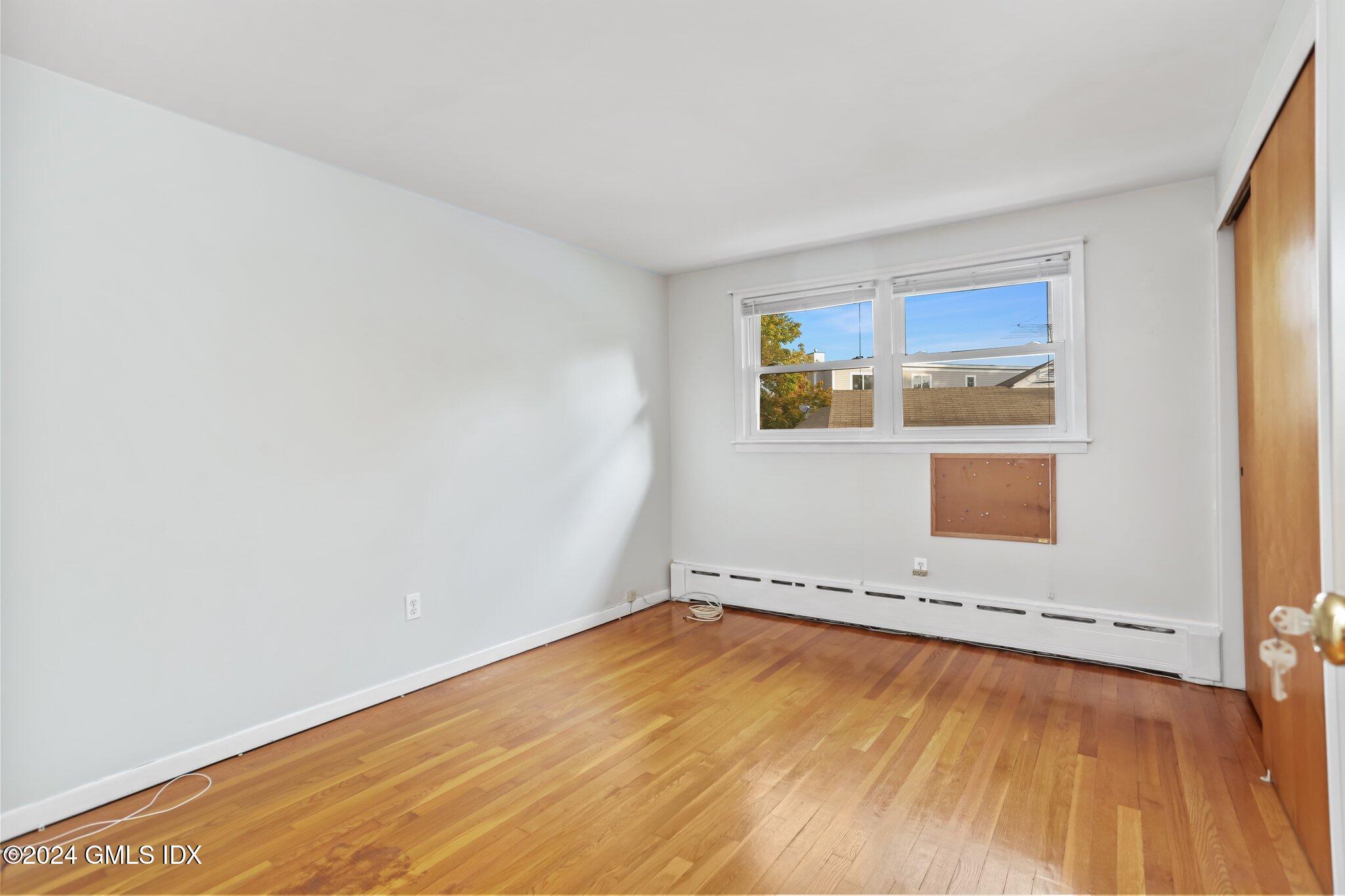 20 Norias Road Greenwich, CT 06830 - Photo 18 of 40 an empty room with a empty space and window